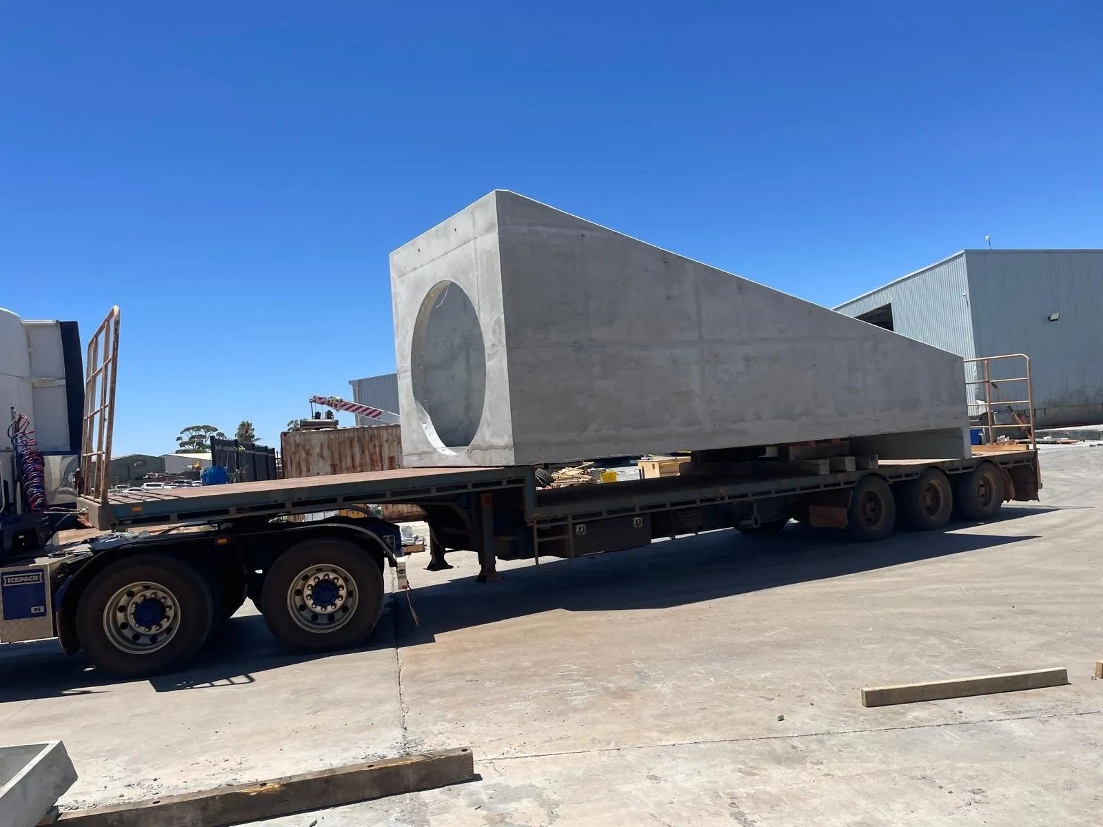 Large precast concrete unit loaded on a trailer for delivery