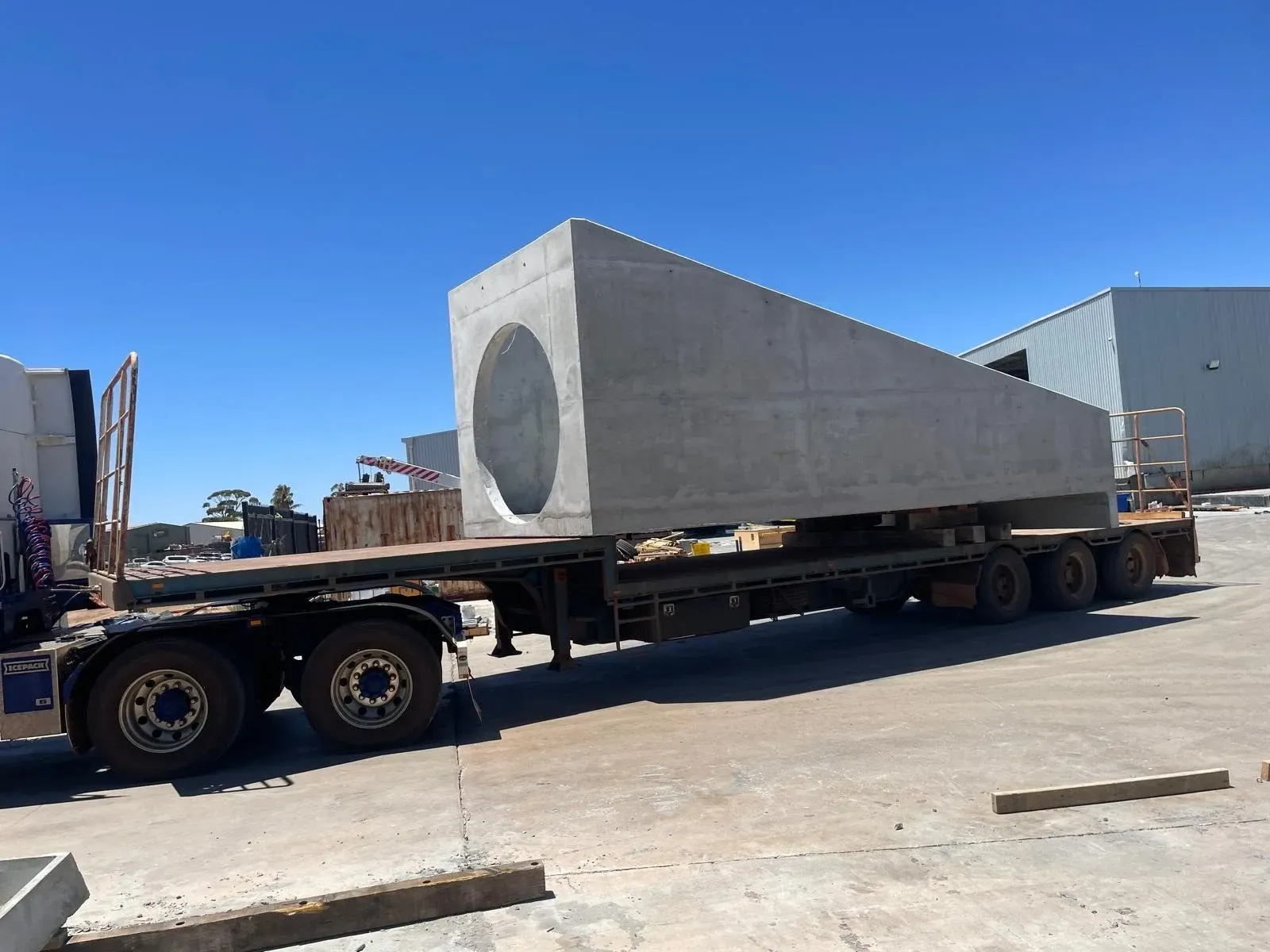 Large precast concrete unit loaded on a trailer for delivery