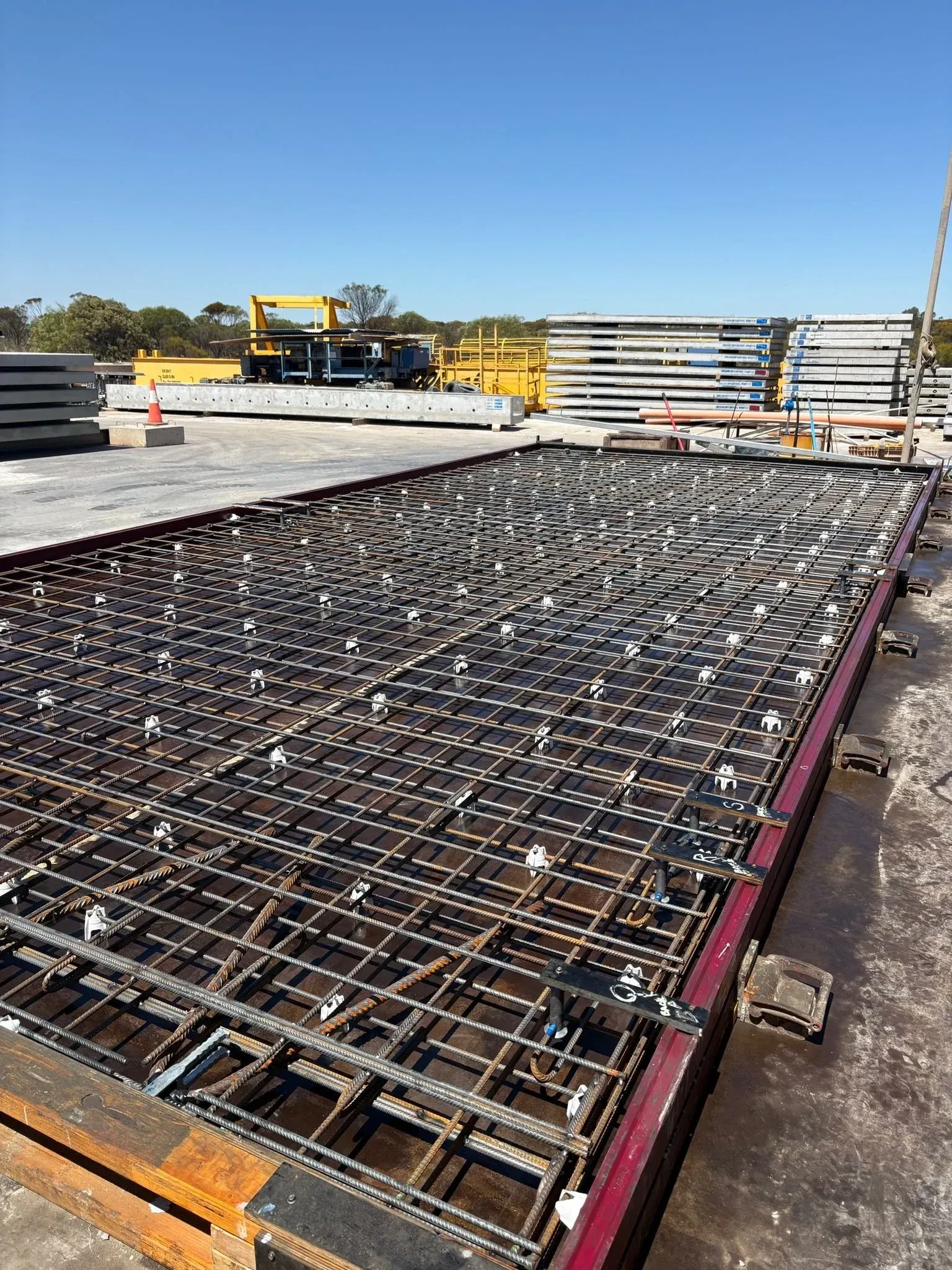Slab reinforcement mesh tied inside a steel casting mould